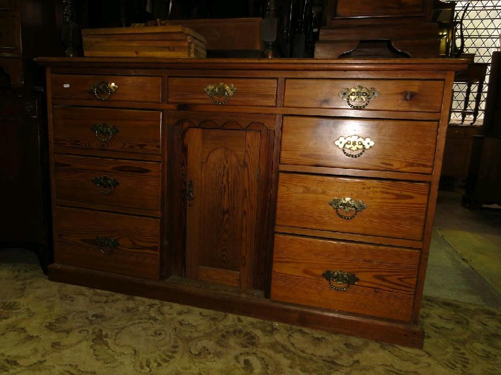 Appraisal: A Victorian pitched pine dresser fitted with an arrangement of