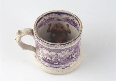 Appraisal: A frog mug printed in purple with scenes of deer