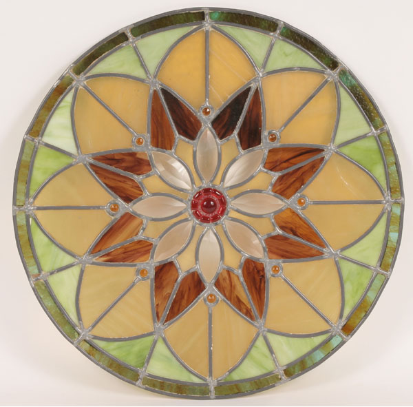 Appraisal: Stained and jeweled glass rosette portal window with multi-colored slag