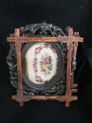 Appraisal: Antique Carved Wooden Frames twig vine styles one with needlepoint