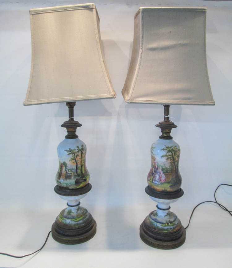 Appraisal: PAIR OF PORCELAIN HAND PAINTED TABLE LAMPS decorated with Rococo