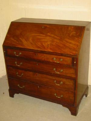 Appraisal: A GEORGE III MAHOGANY BUREAU the fallfront enclosing fitted interior