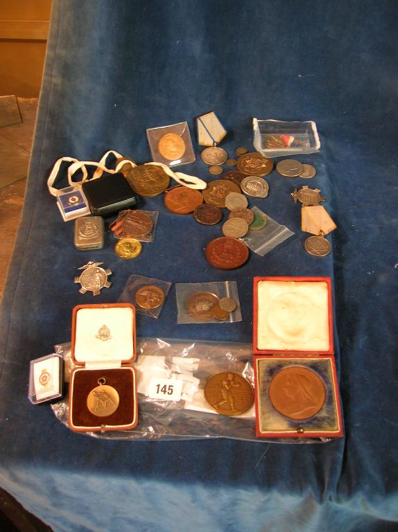 Appraisal: An assorted lot of sports medals badges etc -