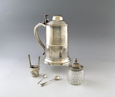 Appraisal: An electroplated tankard of tapering circular form central girdle domed