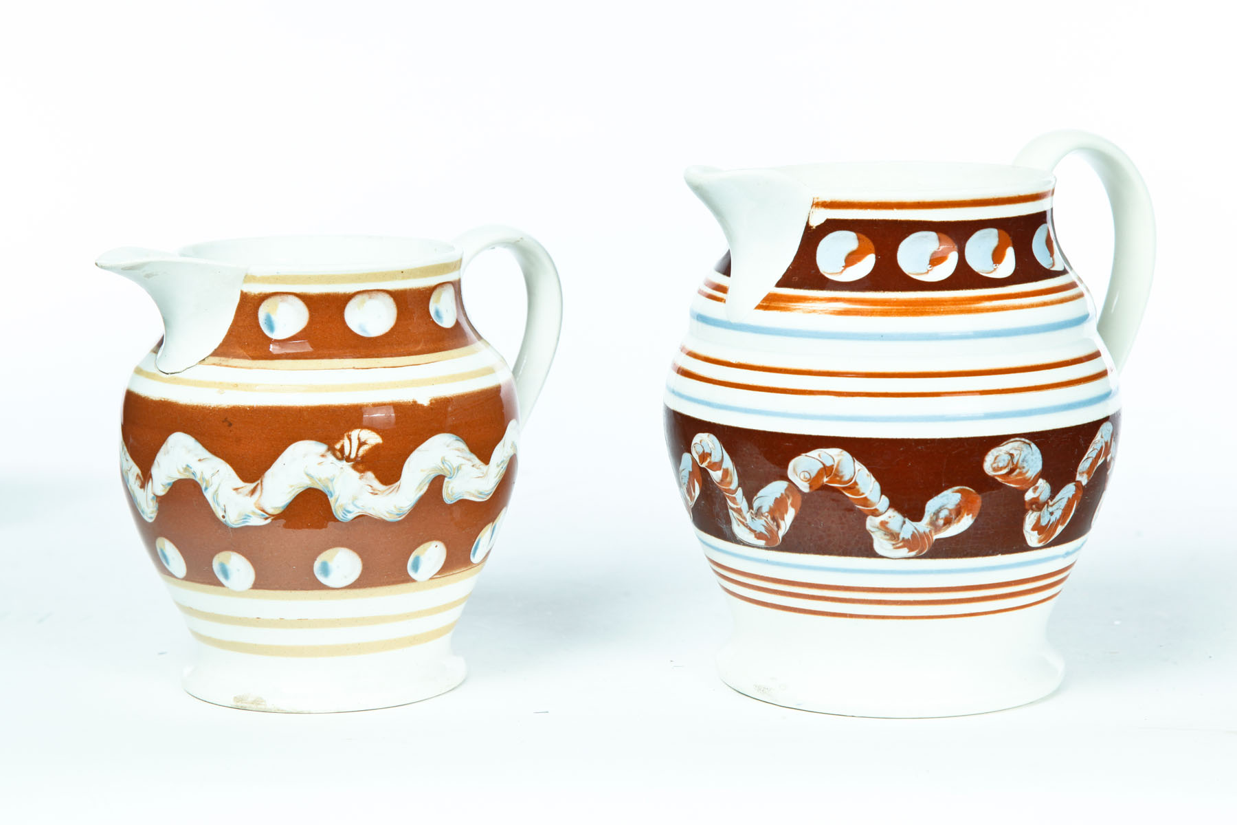 Appraisal: TWO MOCHA PITCHERS England nd quarter- th century Earthworm and