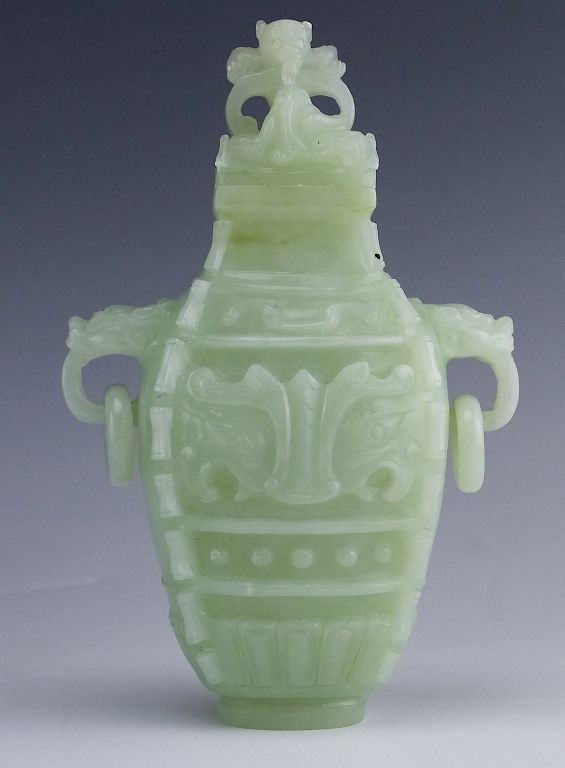 Appraisal: Chinese Jade Figural Reticulated Ring Lidded Urn Chinese green jade