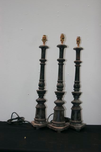 Appraisal: Three carved wooden lamps South India new wiring to Australian