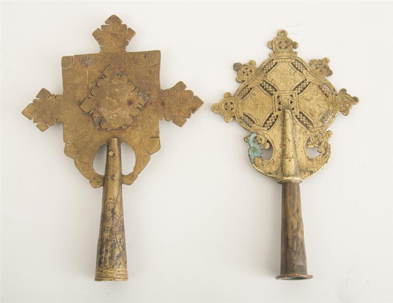 Appraisal: TWO ETHIOPIAN COPTIC GILT-METAL CROSS STANDARDS The larger variously incised