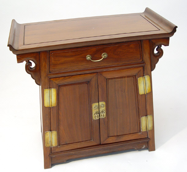 Appraisal: Chinese hardwood cabinet fitted with a frieze drawer and pair