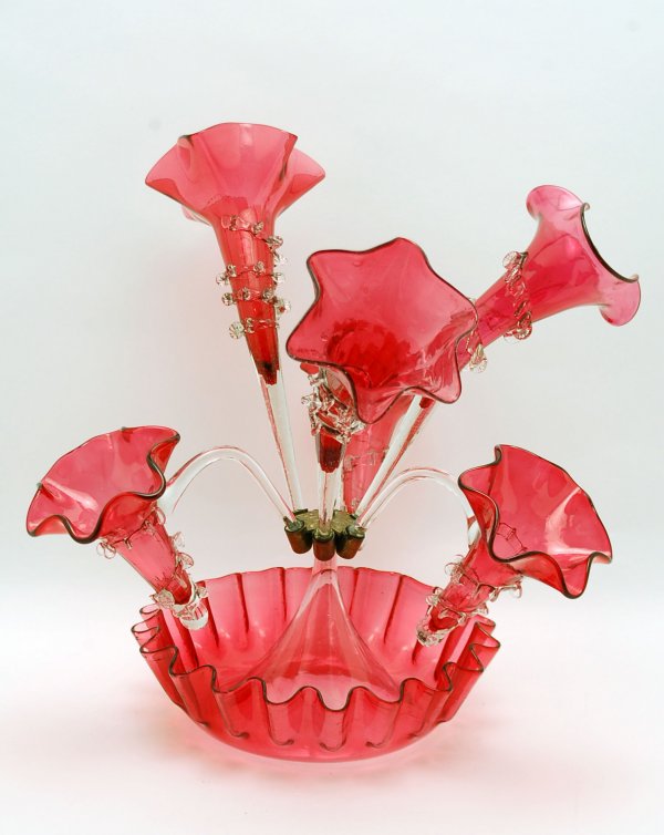 Appraisal: Victorian cranberry glass epergne ruffled base with center brass holder