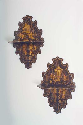 Appraisal: A pair of th century papier mach folding wall brackets