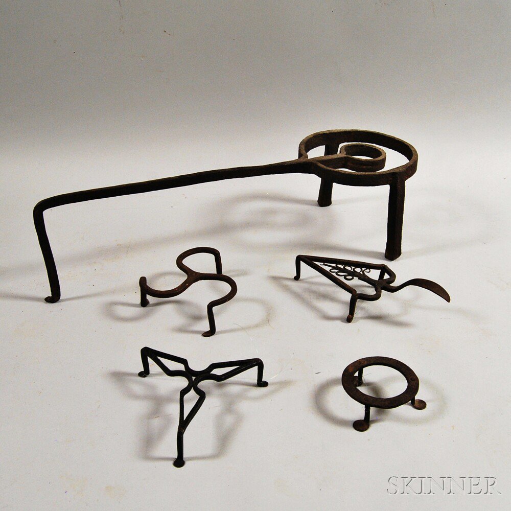 Appraisal: Five Wrought Iron Trivets America late th early th century