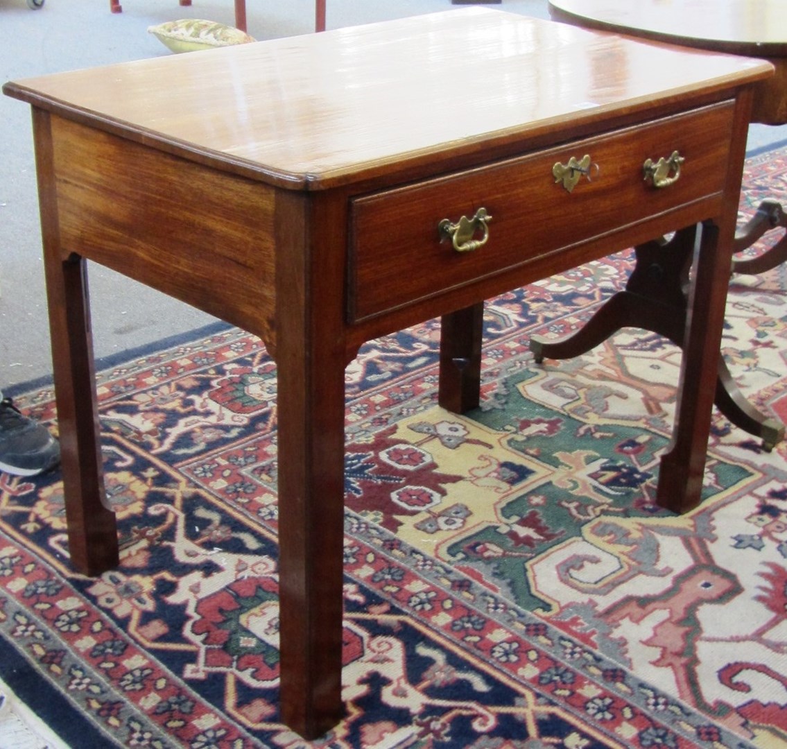 Appraisal: A mid th century mahogany single drawer side table on