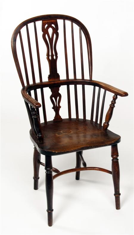 Appraisal: A early th century yew wood high back Windsor chair