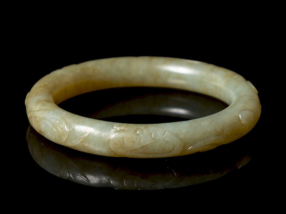 Appraisal: A Chinese Celadon Jade Bangle Interior diam in cm A