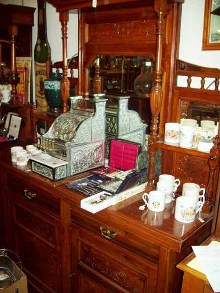 Appraisal: AN EDWARDIAN TWO DRAWER MAHOGANY MIRROR BACK SIDE BOARD