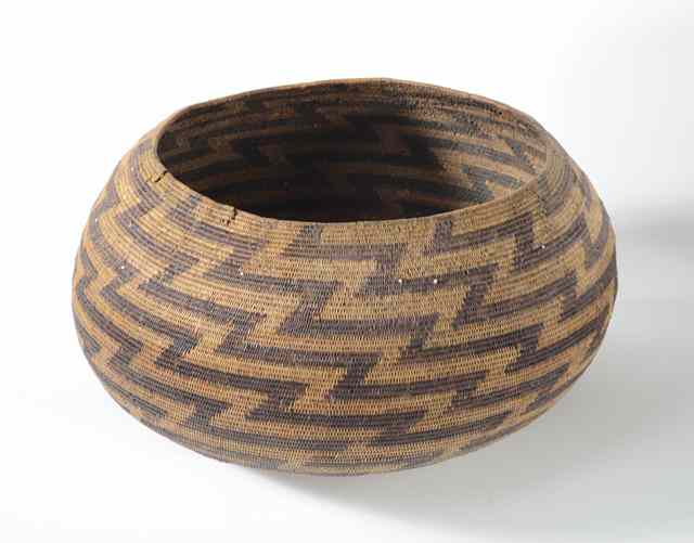 Appraisal: POMO INDIAN BASKET having white beads in the weave accenting