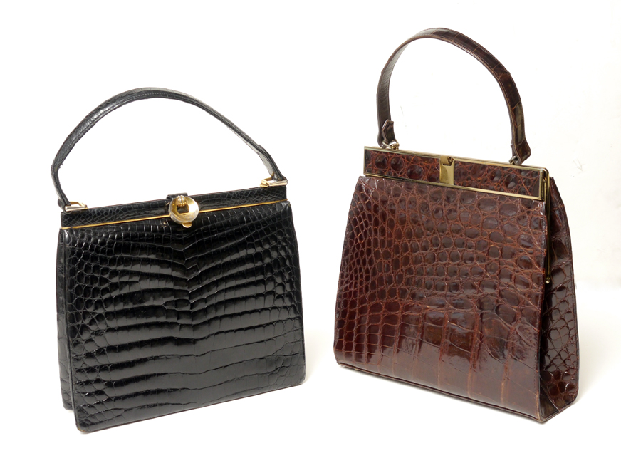 Appraisal: ALLIGATOR HANDBAGS To include Brown with gold toned clasp and