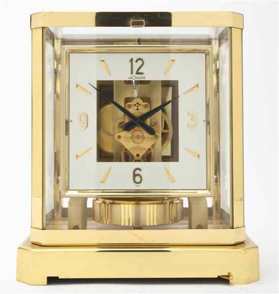 Appraisal: A Brass and Glass Atmos Clock Le Coultre having a