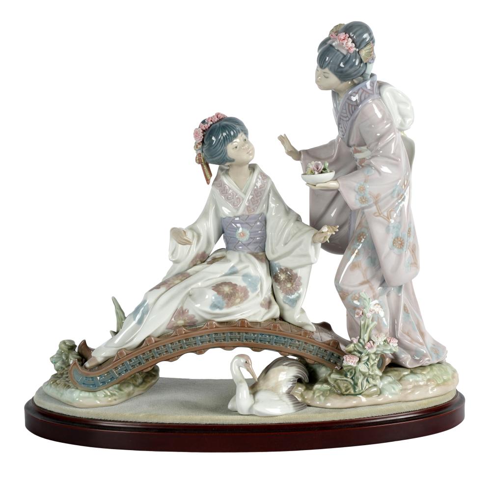 Appraisal: LLADRO PORCELAIN FLOWER GIRL FIGURAL GROUPprinted factory marks with wooden