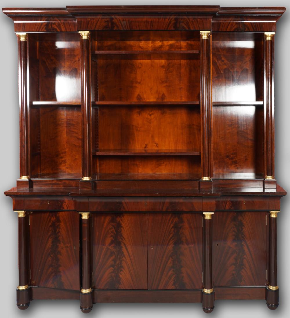 Appraisal: CLASSICAL STYLE MAHOGANY BREAKFRONT BOOKCASE CABINET with adjustable shelves flanked