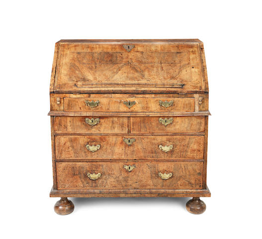 Appraisal: A George I walnut and featherbanded bureau the fall front