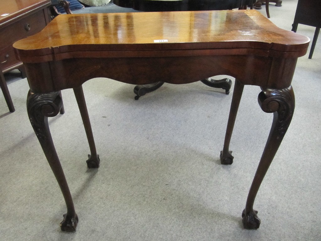 Appraisal: Walnut turnover card table raised on cabriole and ball and