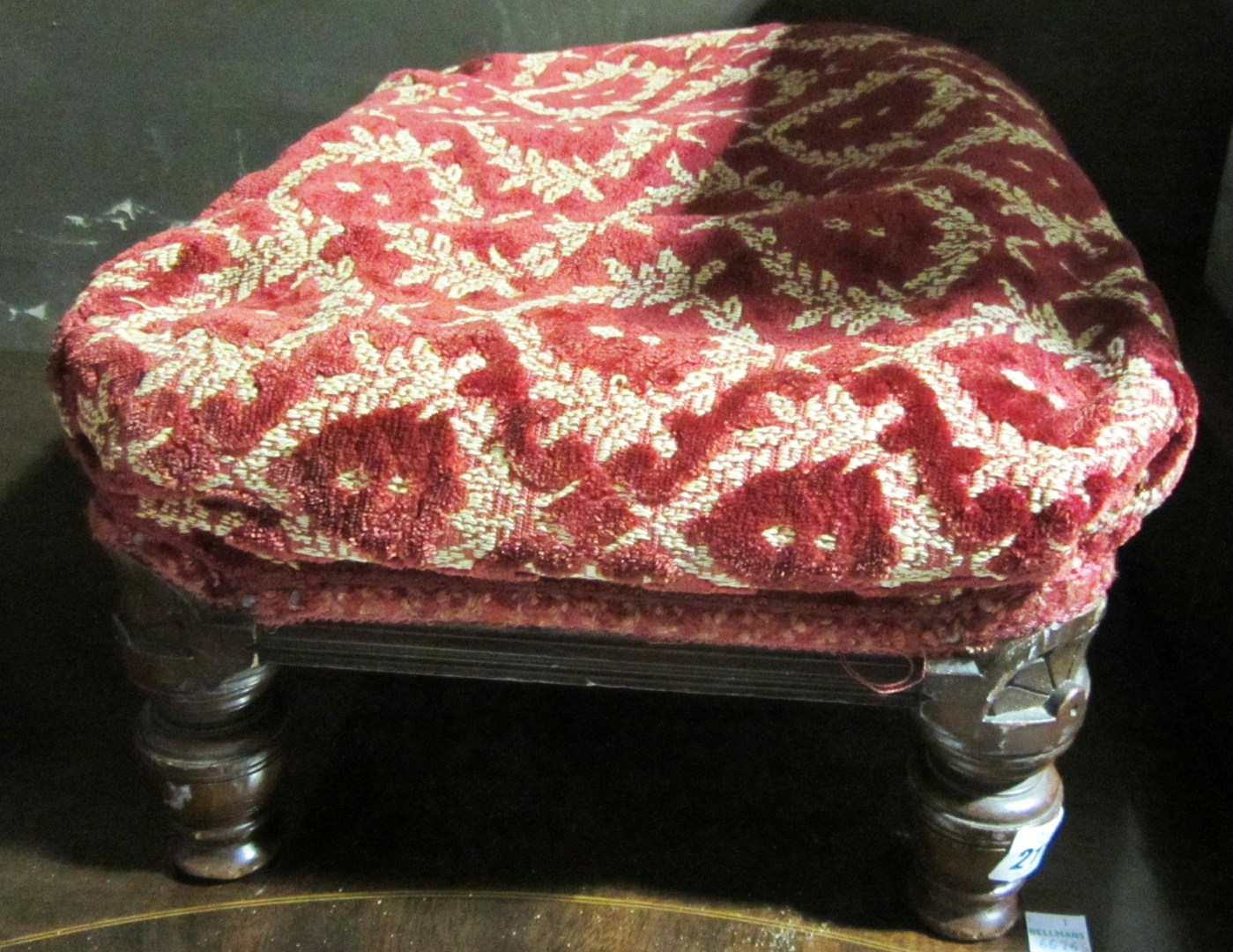 Appraisal: A pair of red upholstered footstools