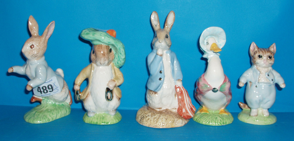 Appraisal: A Collection Of Gold Special Edition Figures Including Peter Rabbit