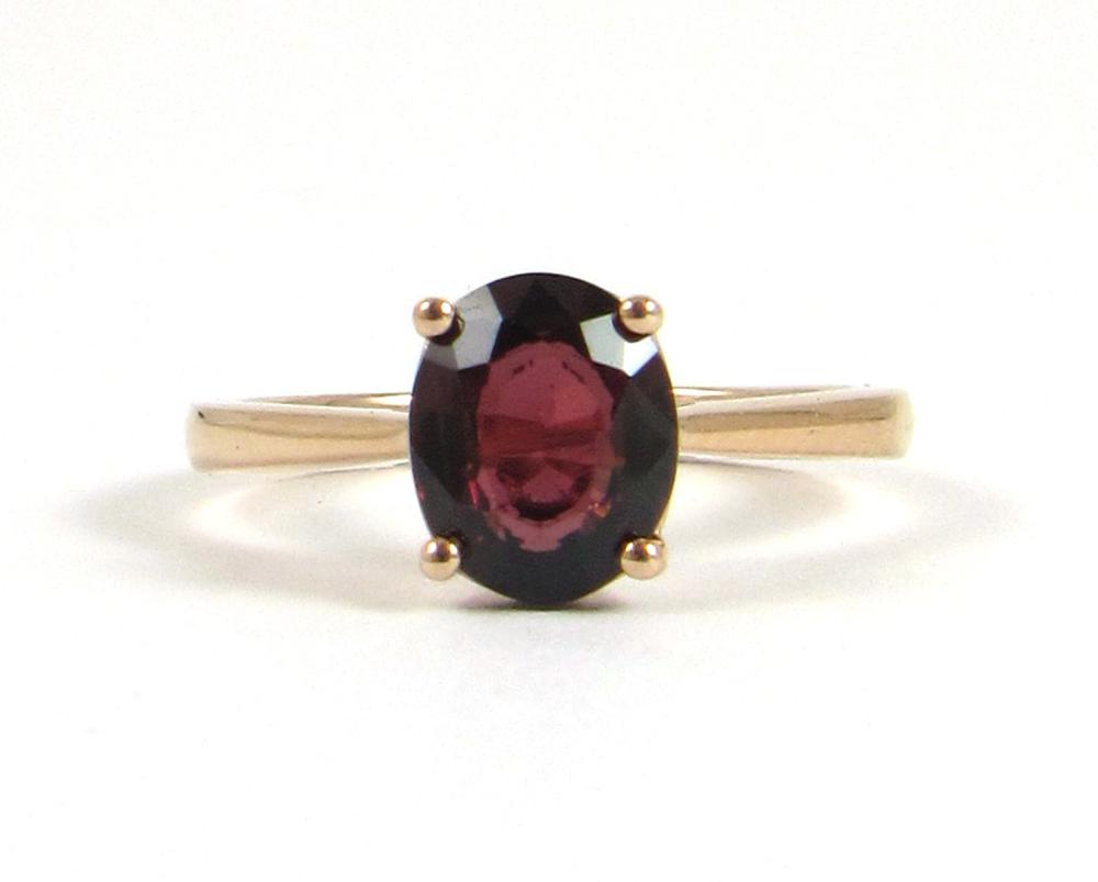 Appraisal: GARNET AND FOURTEEN KARAT ROSE GOLD RING with four rose