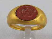 Appraisal: A yellow metal tests high carat gold intaglio ring in