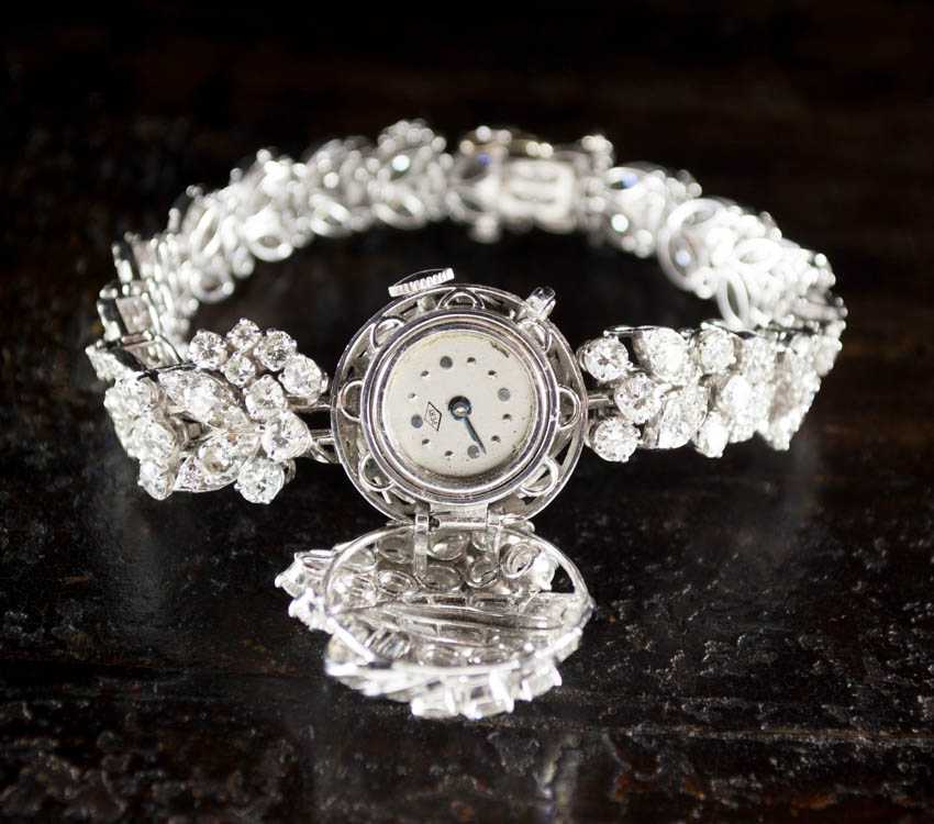 Appraisal: LADY'S ESTATE DIAMOND AND PLATINUM INTEGRAL BRACELET WRIST WATCH the