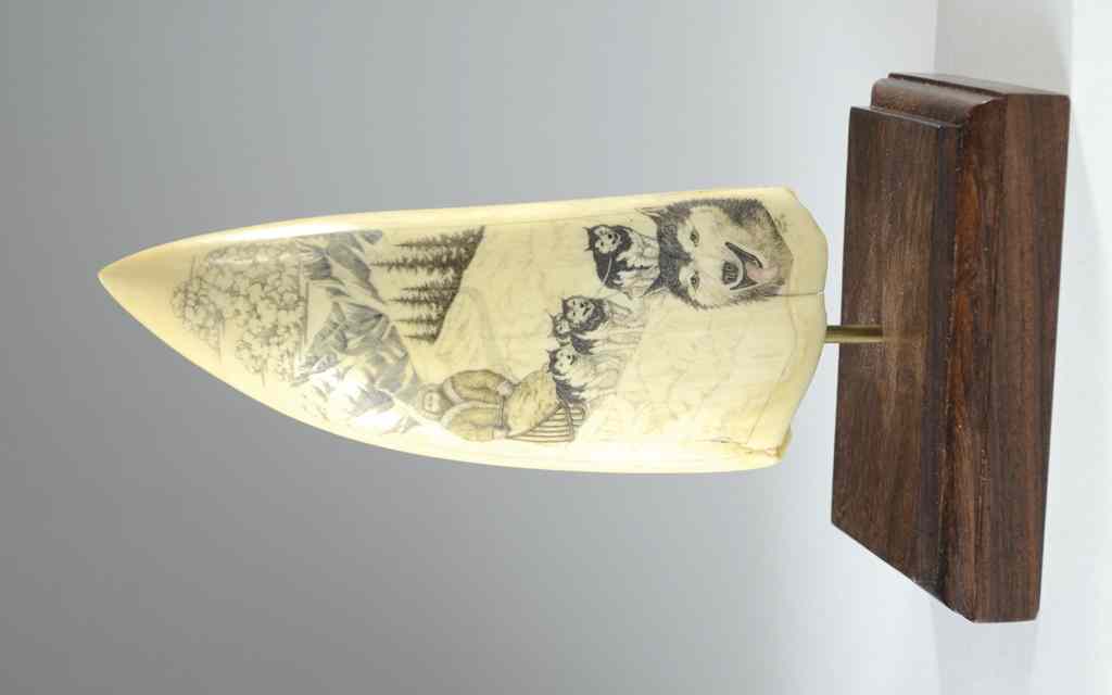 Appraisal: WHALE'S IVORY TOOTH scrimshawed with bearded driver dog team in