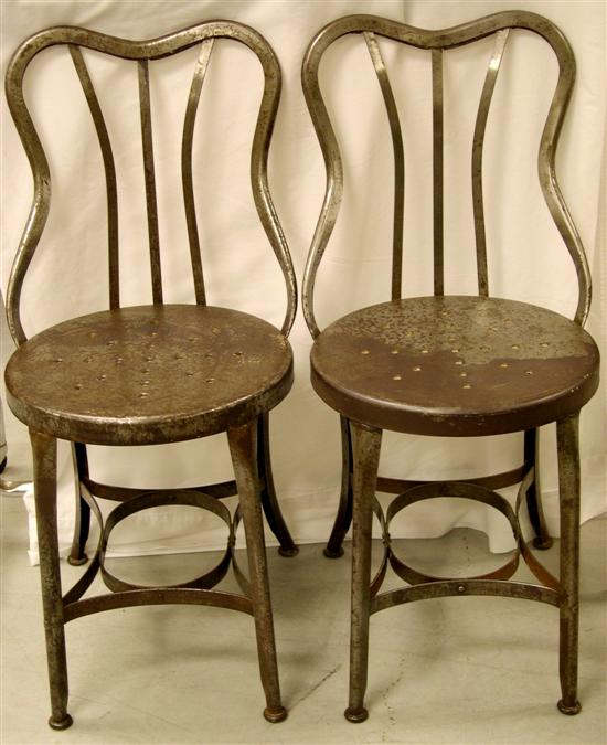 Appraisal: Pair of metal cafe side chairs with double arched back