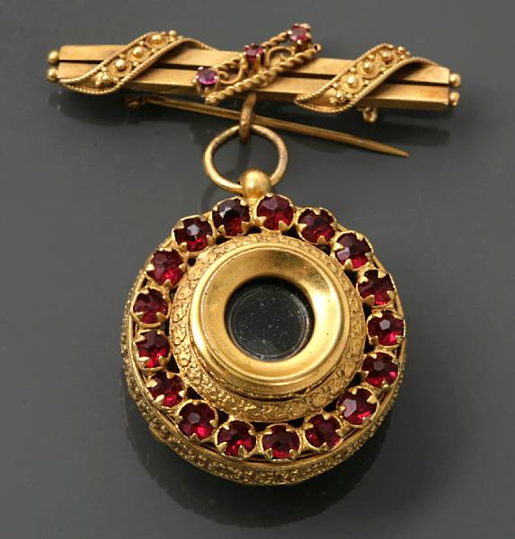 Appraisal: A ruby and k gold bar brooch and metal pendant