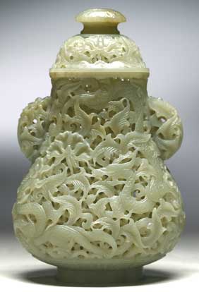 Appraisal: CHINESE RETICULATED JADE VASE Meticulously carved and fully reticulated Chinese