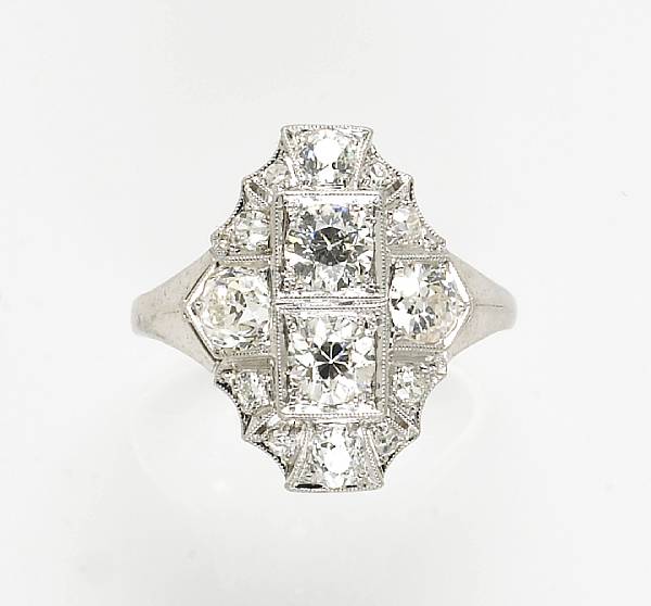 Appraisal: An art deco diamond and platinum ring estimated total diamond