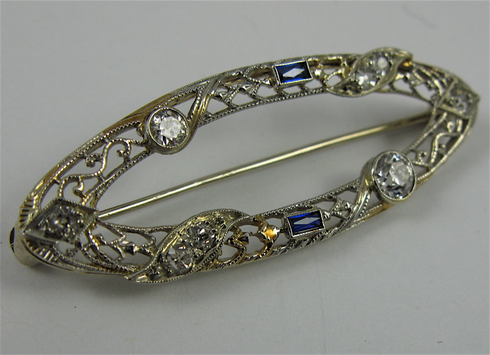 Appraisal: SAPPHIRE DIAMOND AND K WHITE GOLD BROOCH set with round-cut