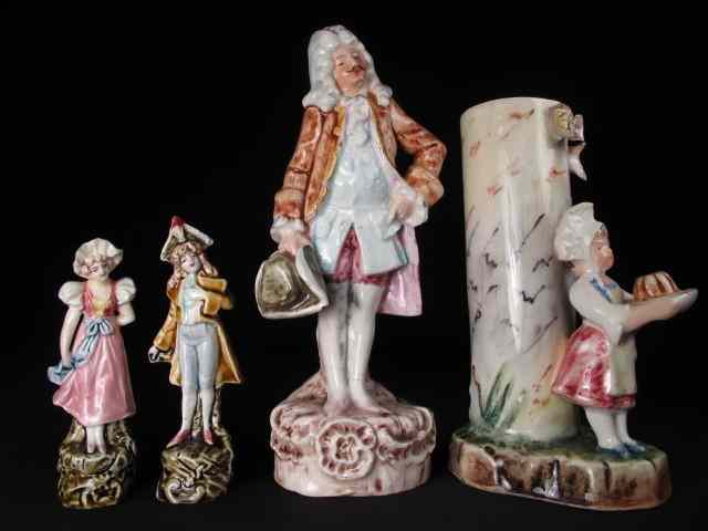 Appraisal: Lot of three Majolica style figurines depicting male and female