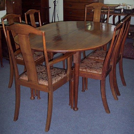 Appraisal: An oak dining table the plank top on taper legs