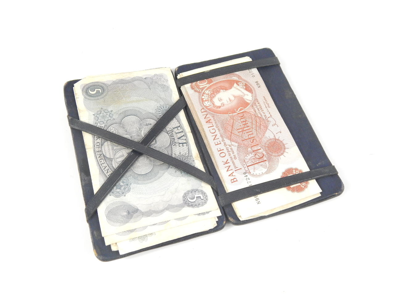 Appraisal: A magic wallet containing eleven ten shilling notes two five