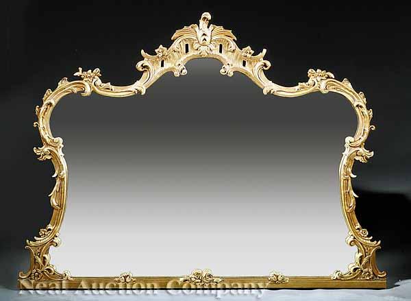 Appraisal: A George II-Style Giltwood Overmantel Mirror rocaille-carved crest over frame