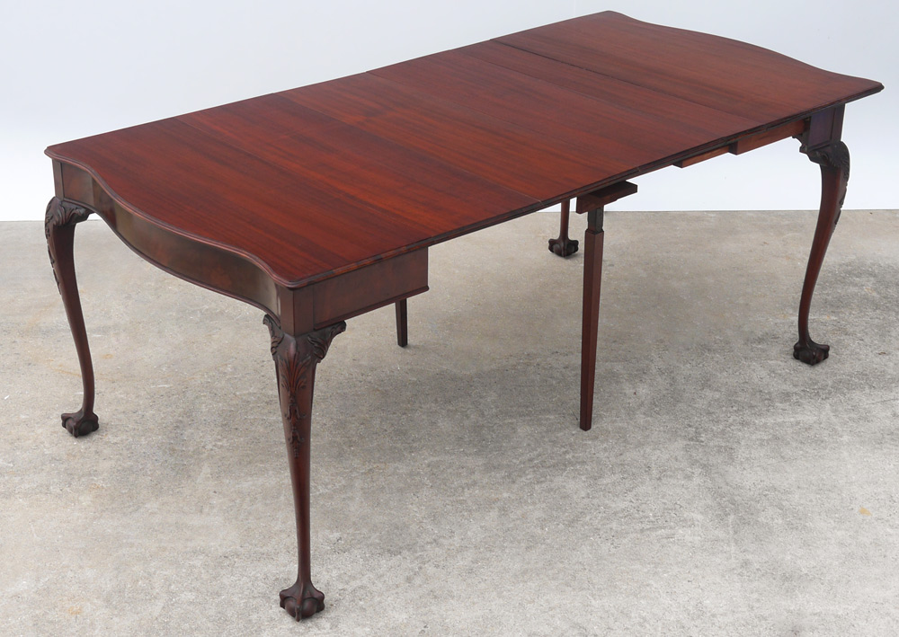 Appraisal: MAHOGANY CHIPPENDALE STYLE CARD DINING TABLE Folding serpentine top with