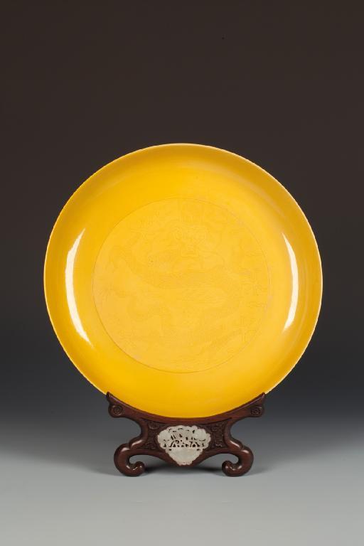 Appraisal: A CHINESE YELLOW GLAZE DRAGON DISH incised to the scaly