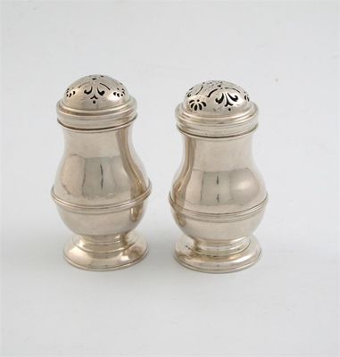 Appraisal: Two very similar George I bun top pepper casters of