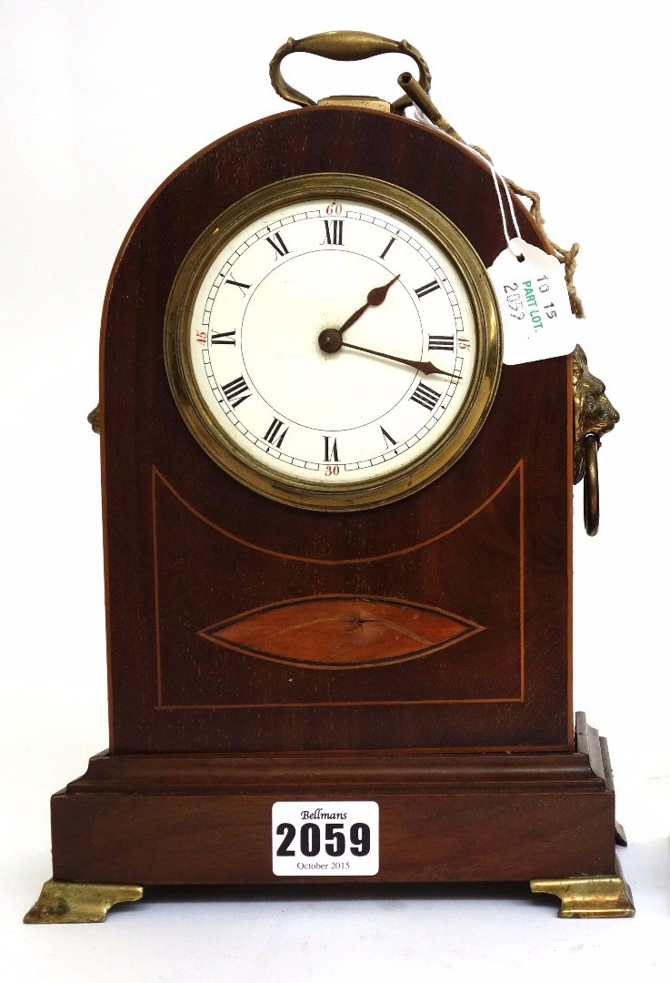 Appraisal: An Edwardian mahogany and inlaid mantel clock the white enamel