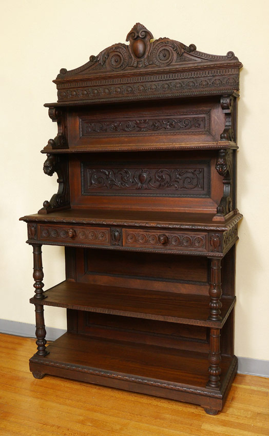 Appraisal: TH C EUROPEAN CARVED WALNUT SIDEBOARD tier step-back sideboard with