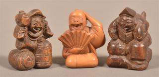 Appraisal: Three Carved Wood Chinese Figural Netsukes Tallest measures - h