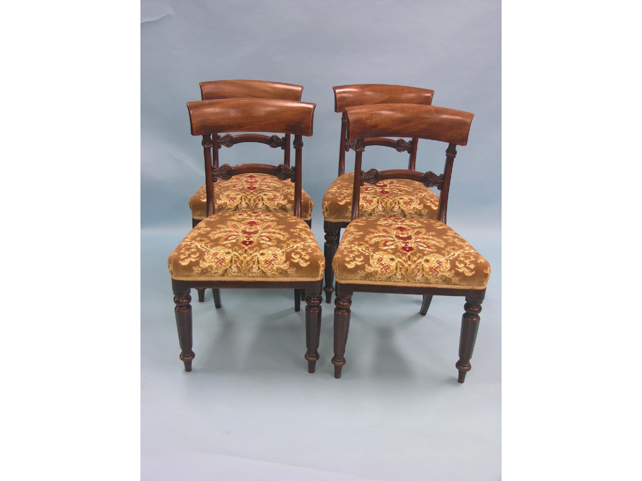 Appraisal: A set of four early Victorian mahogany dining chairs overhanging