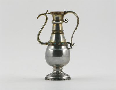 Appraisal: A silver parcel-gilt slender ewer decorated with two bands inlaid